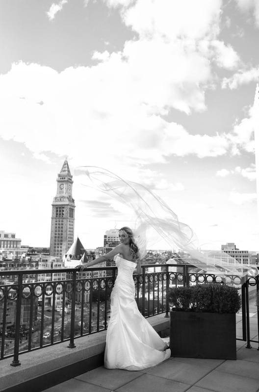 Boston Harbor Hotel, wedding venue in boston, boston wedding photographers, wedding photographers in boston, boston wedding photography, destination wedding in boston, bride on the balcony, bride, flying veil