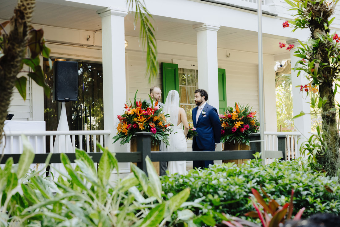Outdoor wedding ceremony under lush tropical trees at Audubon House in Key West Picture