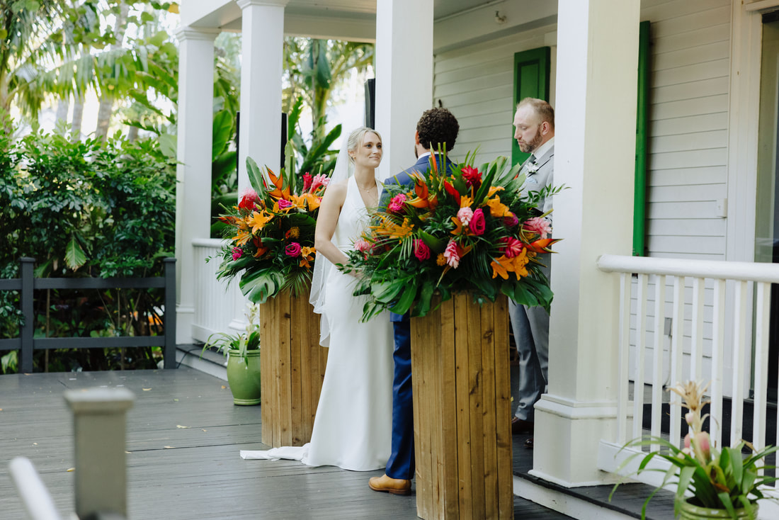 Outdoor wedding ceremony under lush tropical trees at Audubon House in Key West Picture