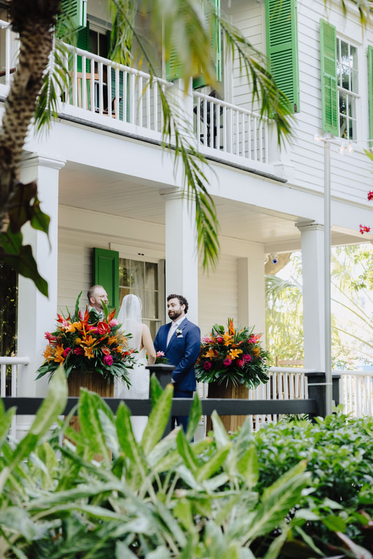Outdoor wedding ceremony under lush tropical trees at Audubon House in Key West Picture