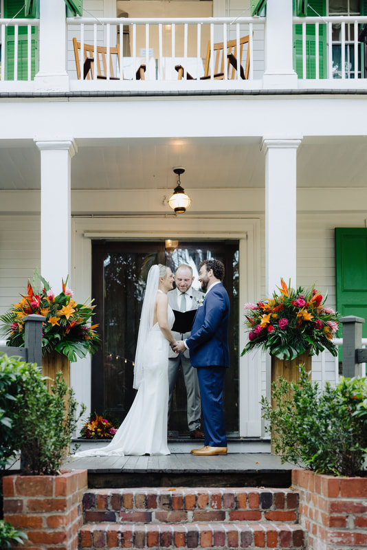 Outdoor wedding ceremony under lush tropical trees at Audubon House in Key West Picture