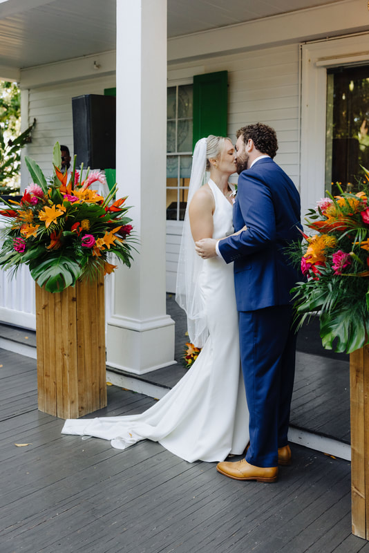 Outdoor wedding ceremony under lush tropical trees at Audubon House in Key West Picture