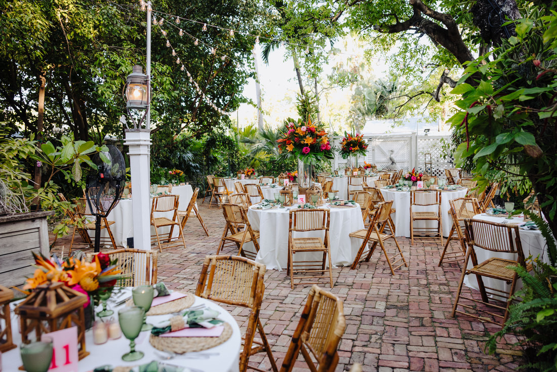 Key West wedding photographer captures ceremony under palm trees at historic venue Picture
