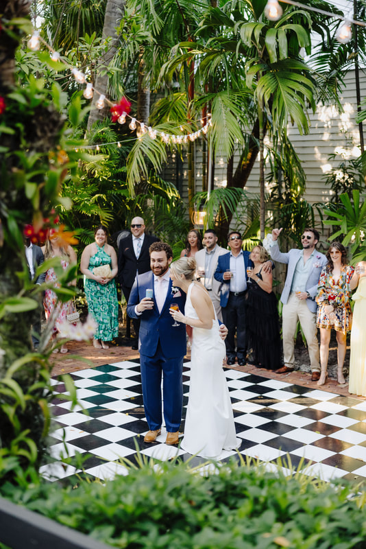 Candid moment during wedding speeches at lush Key West venue, captured by Key West photographer Picture