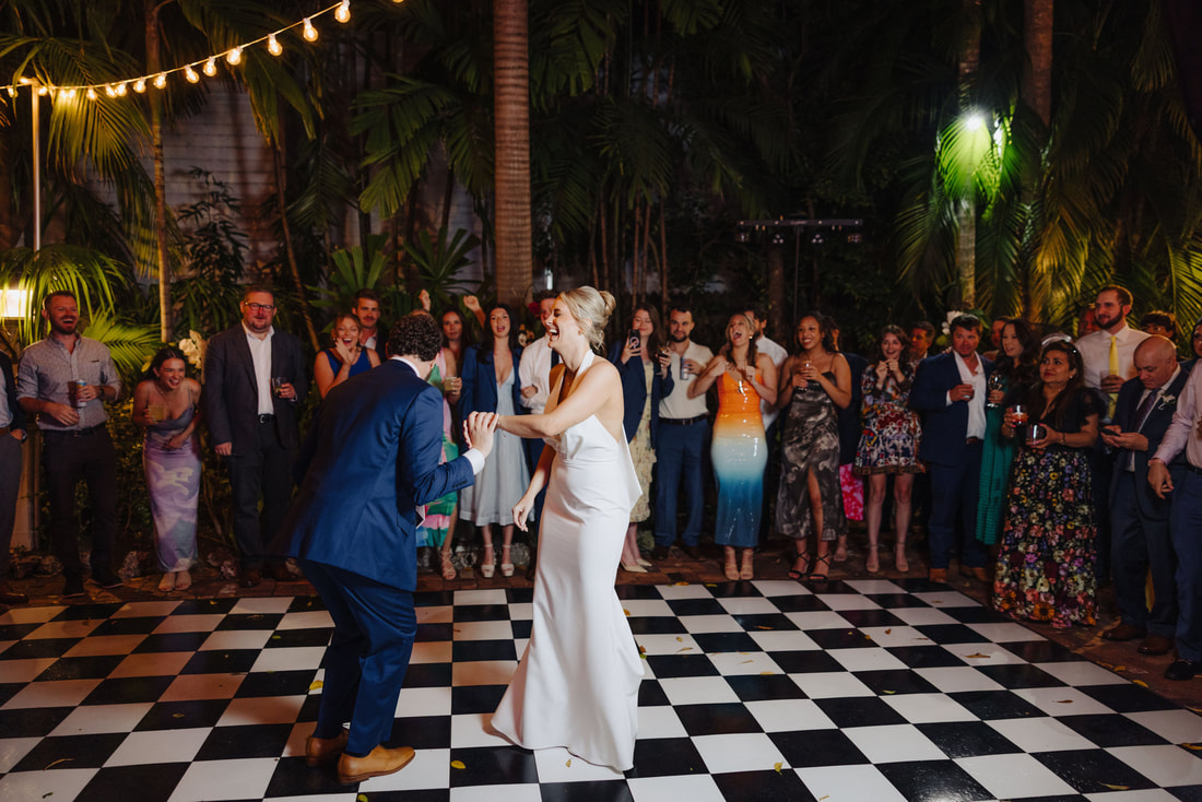 Key West photographer captures joyful first dance during intimate outdoor receptionPicture