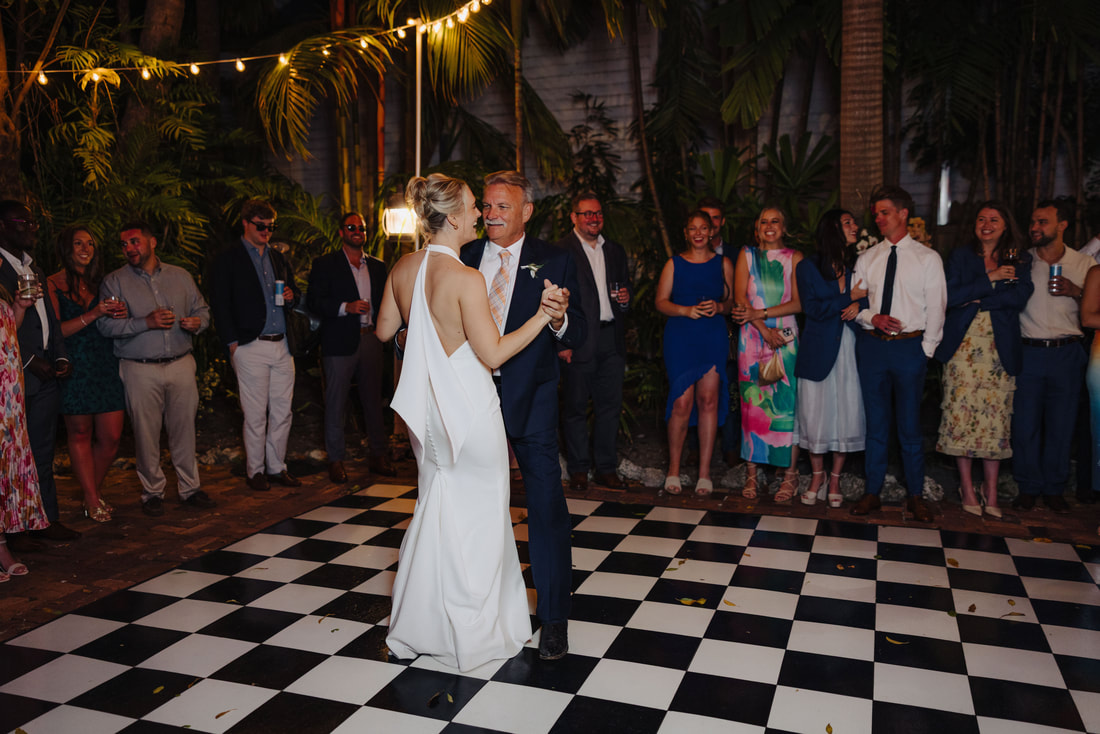 Key West photographer captures joyful first dance during intimate outdoor receptionPicture