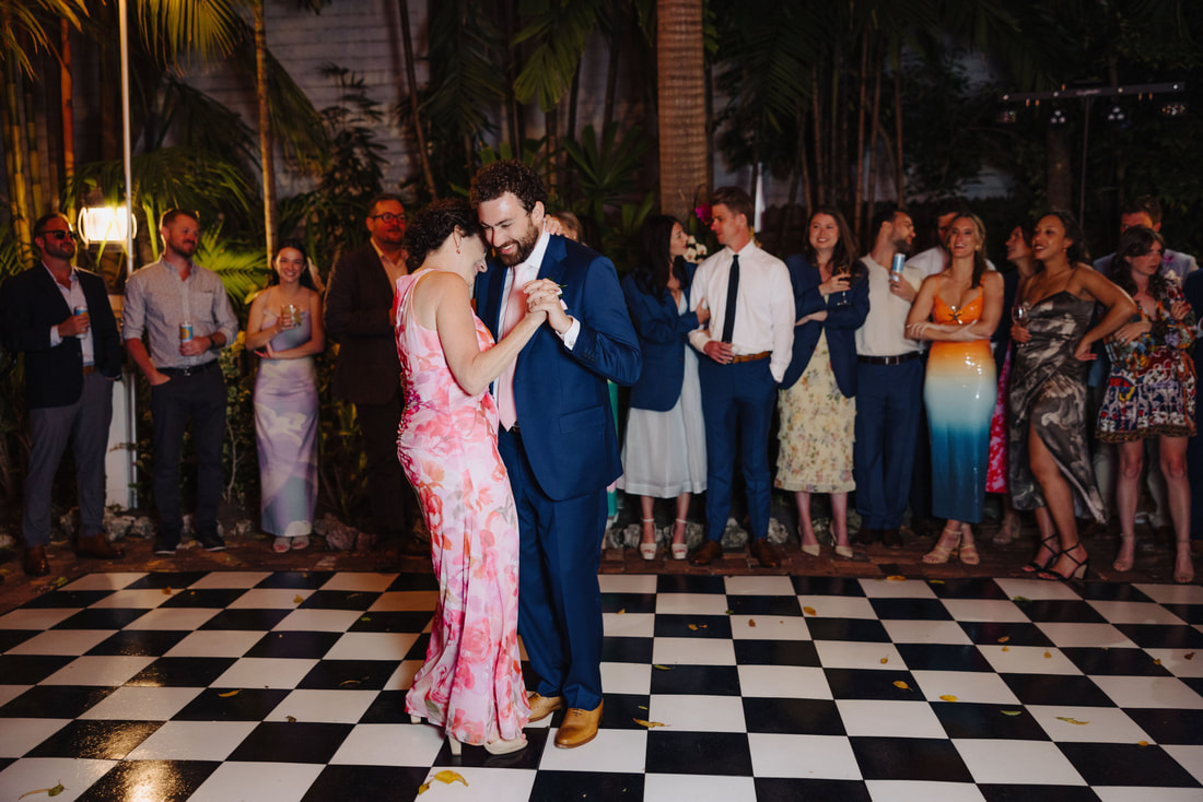 Key West photographer captures joyful first dance during intimate outdoor receptionPicture