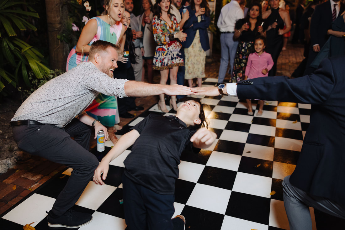 Key West photographer captures joyful first dance during intimate outdoor receptionPicture
