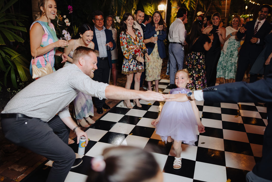 Key West photographer captures joyful first dance during intimate outdoor receptionPicture