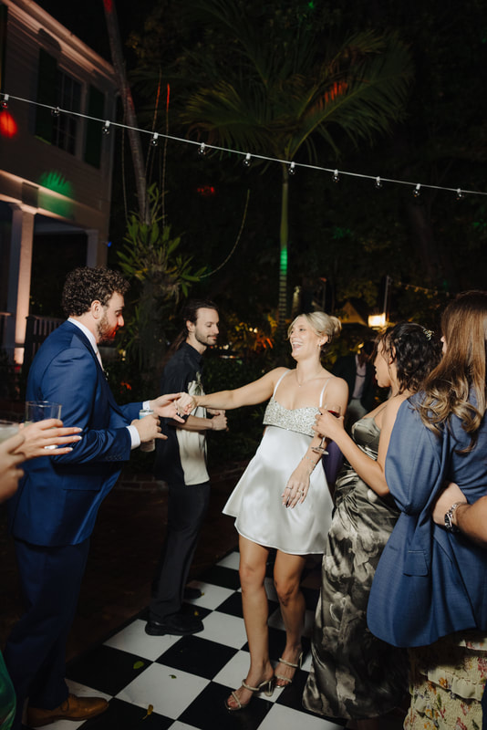 Bride and groom sharing their first dance at Audubon House, captured by Key West photographerPicture