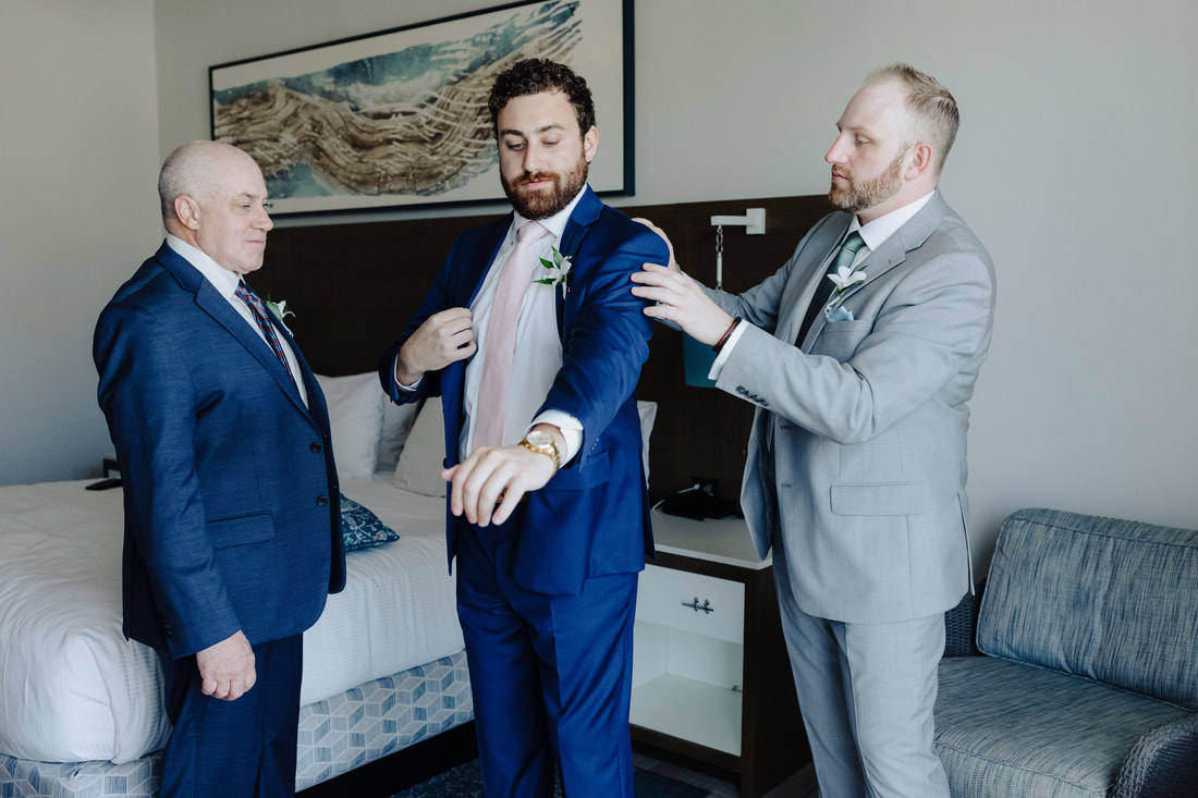 Groom getting ready with best man and family at The Reach Hotel Key WestPicture