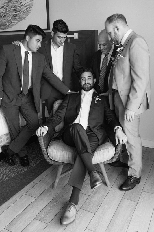 Groom getting ready with best man and family at The Reach Hotel Key West Picture