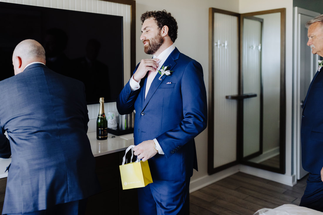Groom getting ready with best man and family at The Reach Hotel Key WestPicture