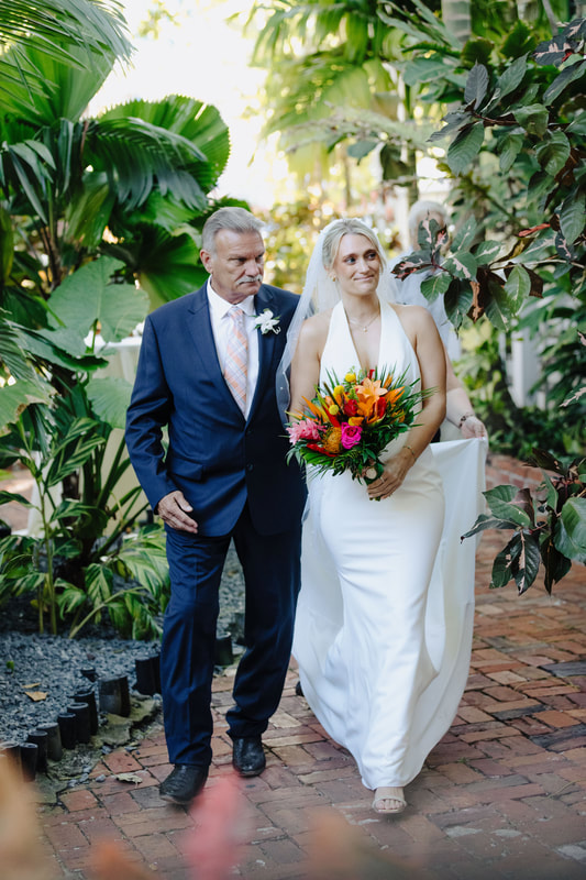 Bride walking down the aisle at historic Audubon House garden wedding Picture