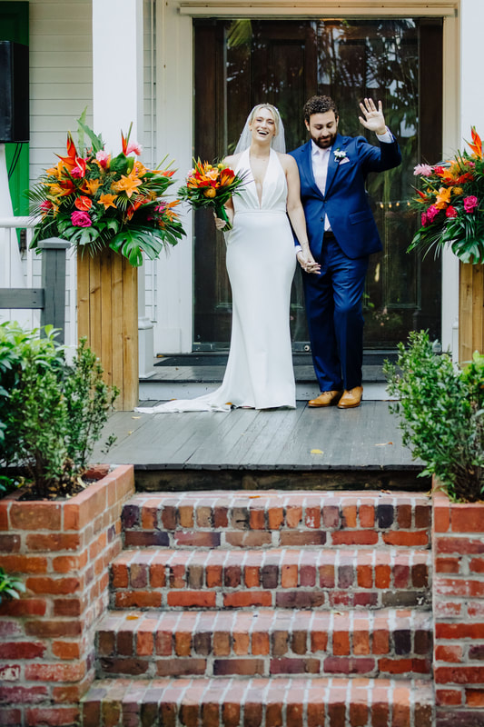 Outdoor wedding ceremony under lush tropical trees at Audubon House in Key WestPicture