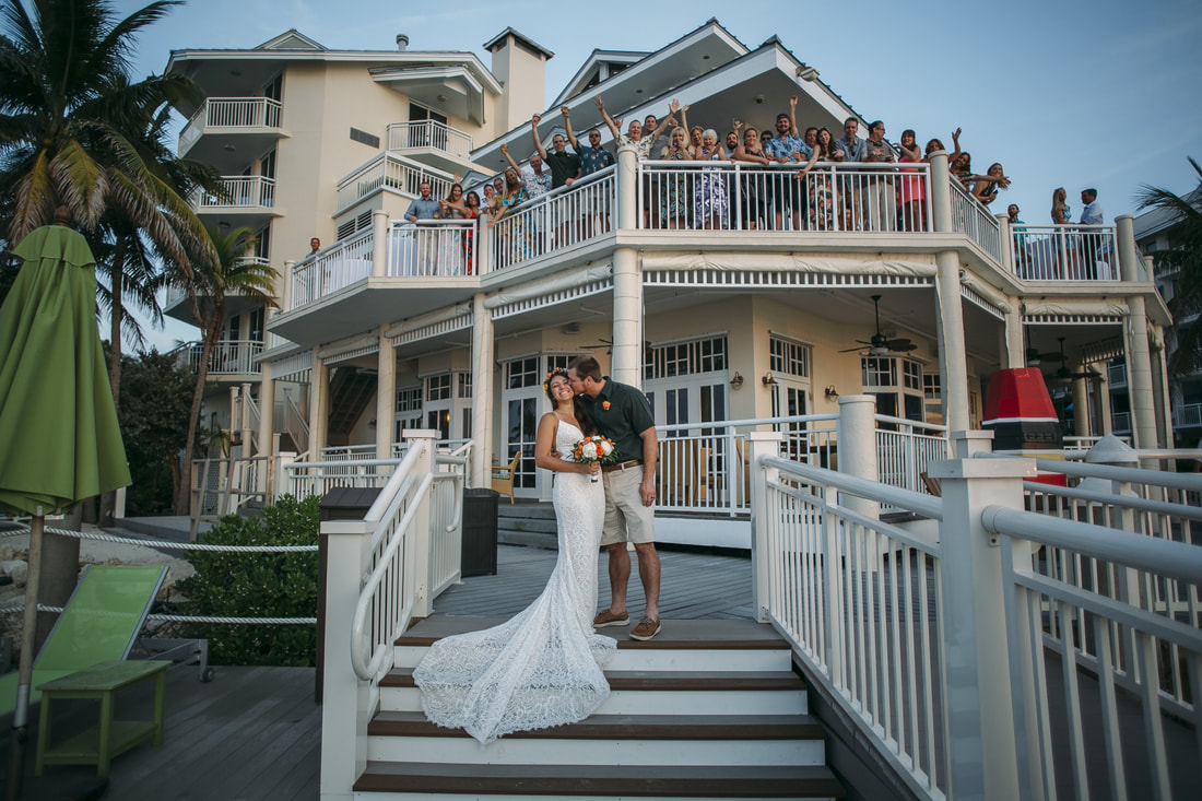 Weddings By Romi, Hyatt Centric wedding, Key West wedding photographer, Key West wedding photography, Family formal shots, Bride and Groom kissing with family behind,