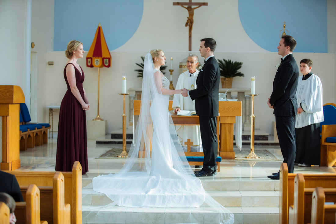 Weddings By Romi, Church wedding, St. Mary's Star wedding, Key West wedding Photographers, Key West wedding Photography, Best wedding Photographers, Bride and groom in the front of the altar