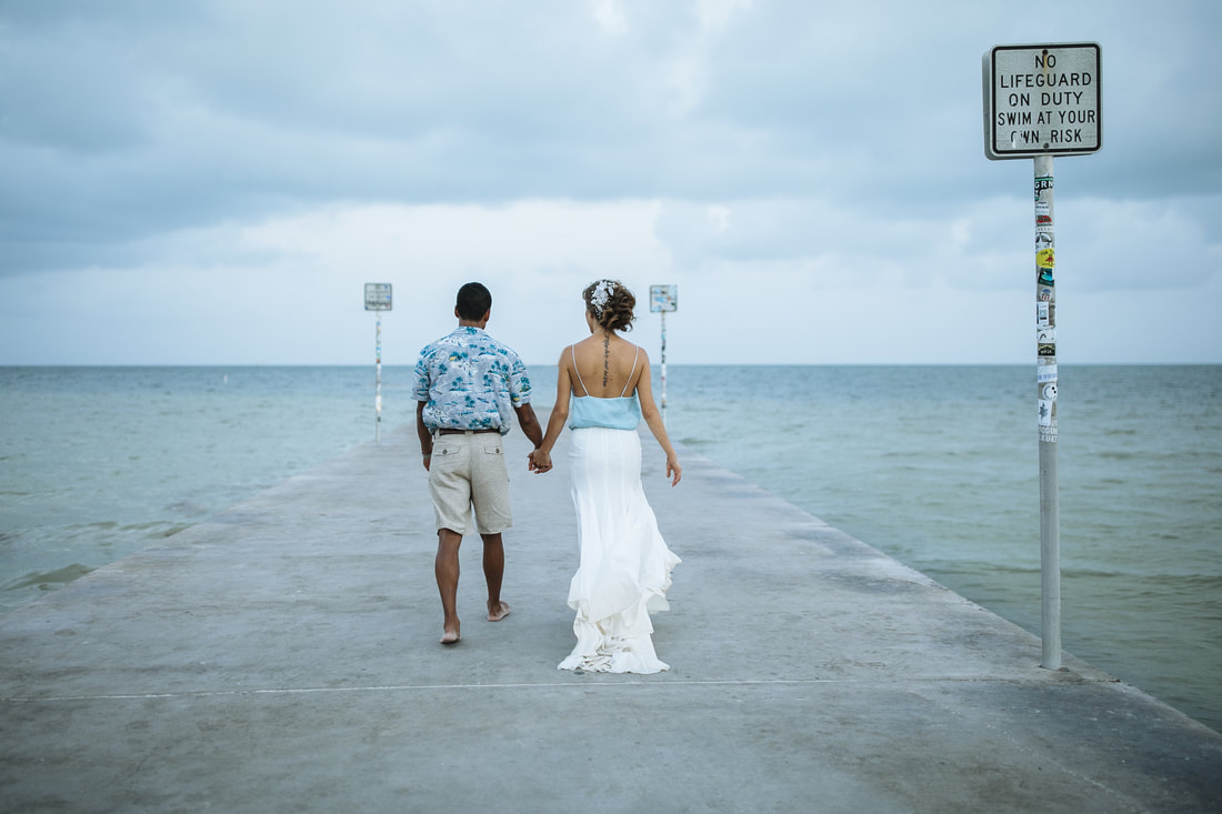 Bride and groom walking away,Bride and Groom, Southernmost Beach Resort, Beach wedding, Reflection, Key West wedding photographer, Weddings By Romi