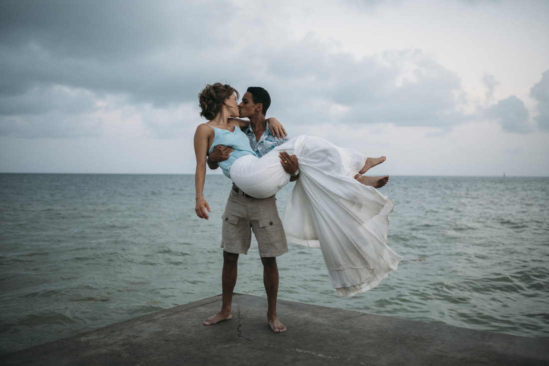 Groom holding a bride, Bride and groom kissing,Bride and Groom, Southernmost Beach Resort, Beach wedding, Reflection, Key West wedding photographer, Weddings By Romi