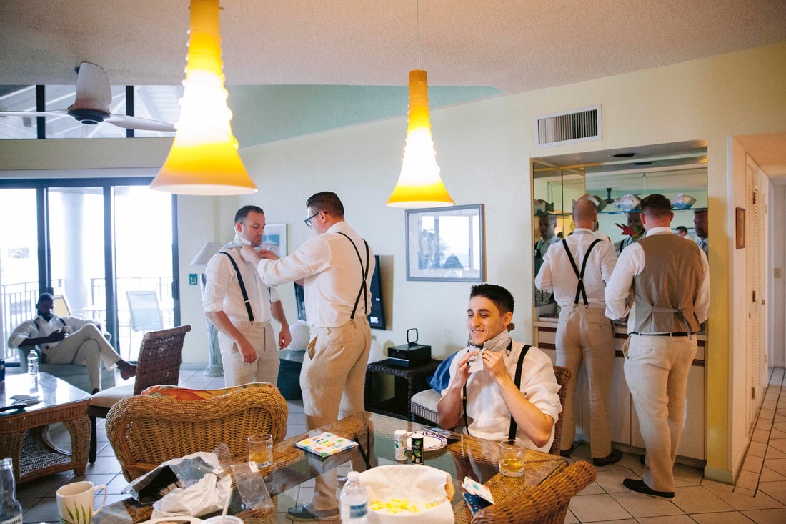 Key West wedding, Groom getting ready, Groomsman tying the tie